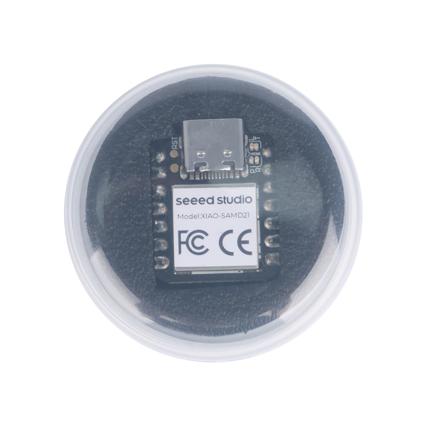 Top view of Seeeduino XIAO SAMD21 Arduino board packaged in plastic case