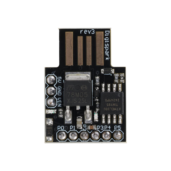 Close-up top view of ATtiny85 USB Digispark development board for Arduino with visible components and USB pads