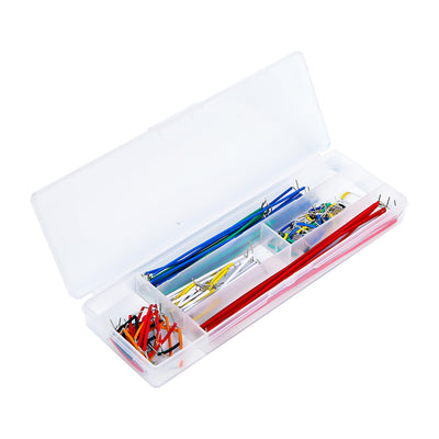 Set of multicolored jumper wires neatly organized in a transparent plastic storage box for electronics projects
