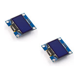 Two complete 1.3-inch SH1106 I2C white OLED display modules with 4-pin headers, arranged on a white background.