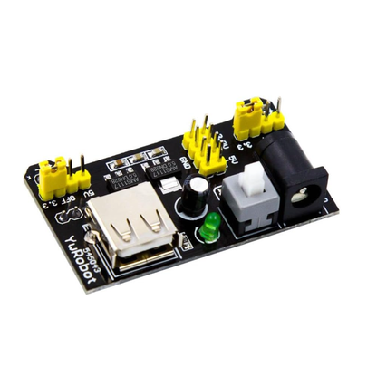 Angled side view of ShillehTek MB102 Arduino power supply module with capacitors and connectors
