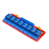 Angled view of ShillehTek 8-channel 24V relay module with orange jumper