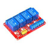 ShillehTek 4-channel 24V relay module angled view with yellow jumpers and blue relays