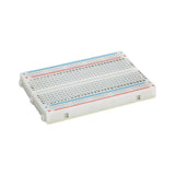 Side angle of ShillehTek 400-point small solderless breadboard showing holes and markings