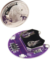 ShillehTek Lilypad CR2032 coin cell battery holder beside a US quarter for size comparison