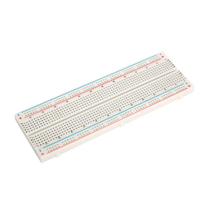Isolated solderless breadboard showing connection strips and labels