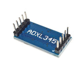 Backside of blue ShillehTek ADXL345 3-Axis accelerometer sensor board with pins