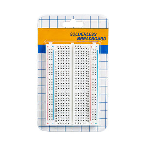 ShillehTek 400-point small solderless breadboard in packaging with grid background