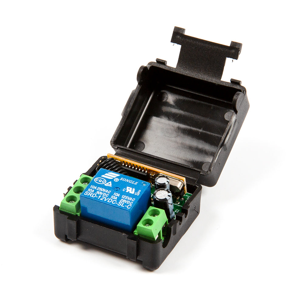 Open black plastic casing showing blue relay component inside ShillehTek module