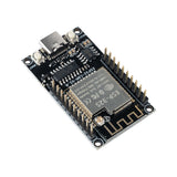 Close image of ESP32-CAM WiFi and Bluetooth module on black PCB