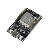 ESP32-CAM development board angled showing USB port, buttons, and antenna module