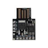 Close-up top view of ATtiny85 USB Digispark development board for Arduino with visible components and USB pads