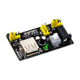 Breadboard power supply module with USB port, power jack, jumper pin headers, and power switch