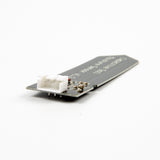 Capacitive Soil Moisture Sensor V1.2 showing white 3-pin connector and circuit components on black PCB
