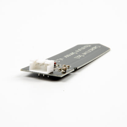 Capacitive Soil Moisture Sensor V1.2 showing white 3-pin connector and circuit components on black PCB