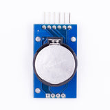 DS3231 AT24C32 precision RTC I2C module showing CR2032 lithium battery on blue PCB