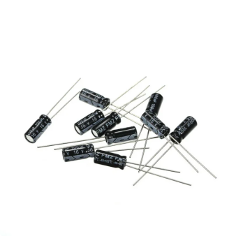 Several black cylindrical electrolytic capacitors with metal leads for electronic circuits