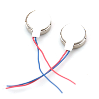 Two flat coin vibration motors with red and blue wires for Arduino Raspberry Pi and ESP32 projects