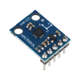 Close-up of HMC5883L GY-273 3-axis magnetometer compass module showing chip and pin headers