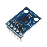 HMC5883L GY-273 3-axis magnetometer compass module with pins and axis markings on blue PCB