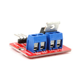 IRF520 MOSFET driver module showing blue terminal blocks and metal heat sink for Arduino and ESP32 projects
