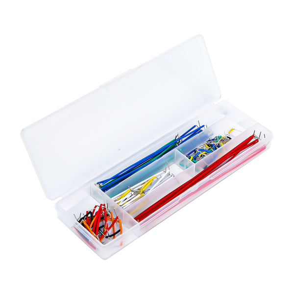 Set of multicolored jumper wires neatly organized in a transparent plastic storage box for electronics projects