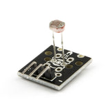 KY-018 photoresistor light sensor module with black PCB and three-pin header for Arduino and ESP32
