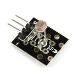KY-018 photoresistor light sensor module with three pins and resistor on black PCB for Arduino and ESP32