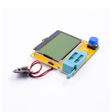 LCR-T4 transistor tester with large LCD screen, blue test socket, and battery clip for electronics testing