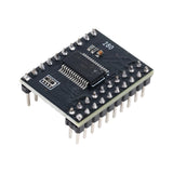 Close-up of MCP23017 I2C 16-bit I/O port expander showing pins and chip on black PCB