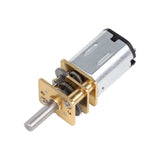 Close-up of N20 micro metal gear motor showing brass gears and metal shaft for robotics projects