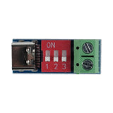 PDSink PD Decoy fast charging test board showing USB-C port, red DIP switch, and green terminal block
