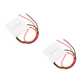Two TEC1-12706 Peltier cooler plates, each with its attached red and black wires and exposed wire ends.