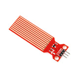 Rain and water level detection sensor module with red PCB and copper traces for Arduino and ESP32 projects