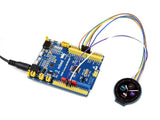 1.28 inch round IPS LCD display module connected to a blue mbed ARM Cortex development board with colorful jumper wires