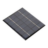 Close-up angled view of 110x136mm 6V 2W solar panel showing solar cells and protective coating