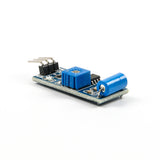 SW-420 vibration sensor module with blue potentiometer and cylindrical sensor component for Arduino projects