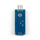Back side of SW-420 vibration sensor module showing solder points and pin connectors for Arduino projects