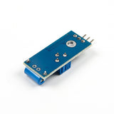 Back view of SW-420 vibration sensor module showing solder points and mounting hole for Arduino projects