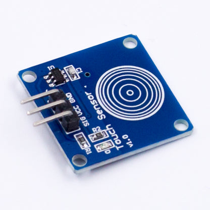 TTP223B capacitive touch switch sensor module with blue PCB and three pin headers angled view