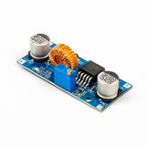 XL4015 adjustable DC-DC step-down module with capacitors, coil, and blue potentiometer on blue PCB