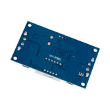 Back side view of XL4015 adjustable DC-DC step-down module showing solder points and circuit traces