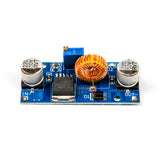 XL4015 adjustable DC-DC step-down module showing capacitors, coil, and blue potentiometer on blue PCB